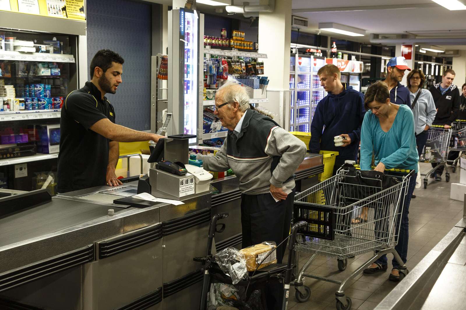 Elderly man grocery shopping