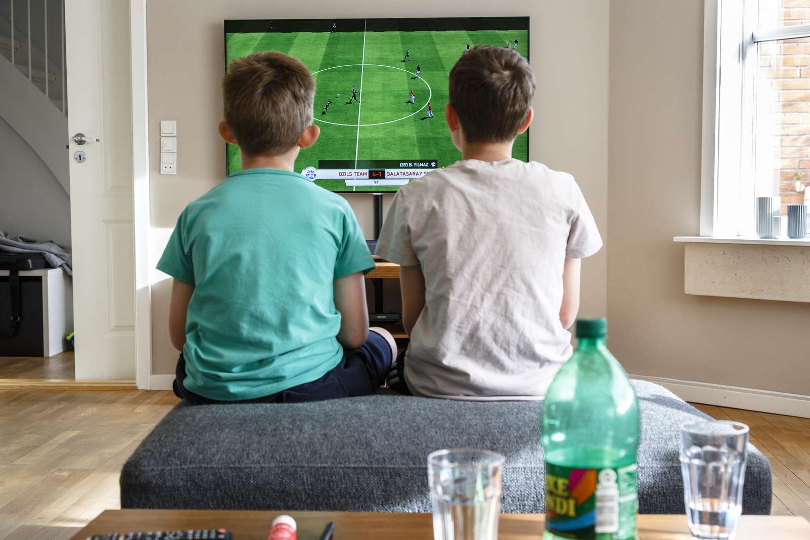 Two boys playing FIFA