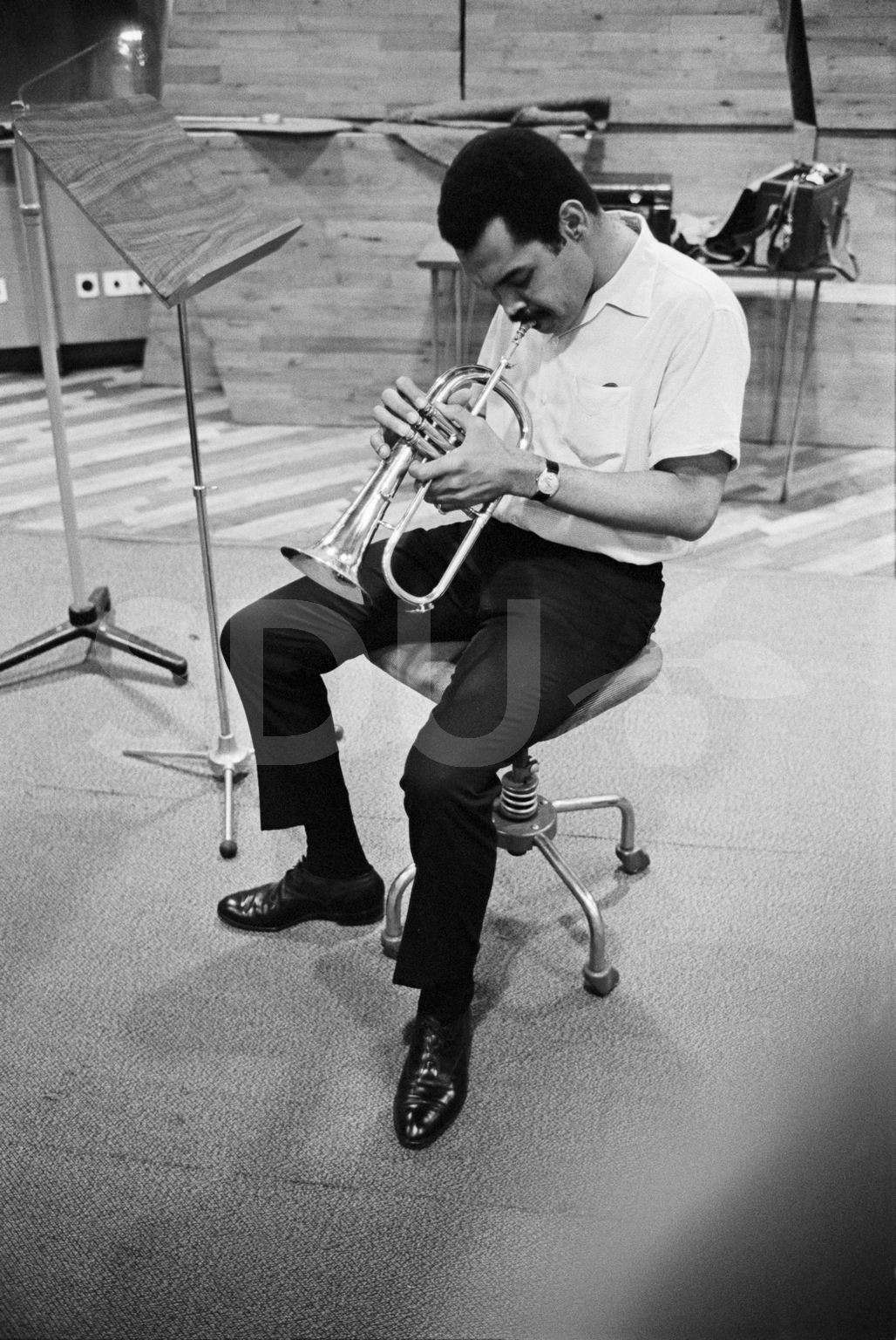 Art Farmer. Practicing on his trumpet in the Radio House, Copenhagen, 1965
