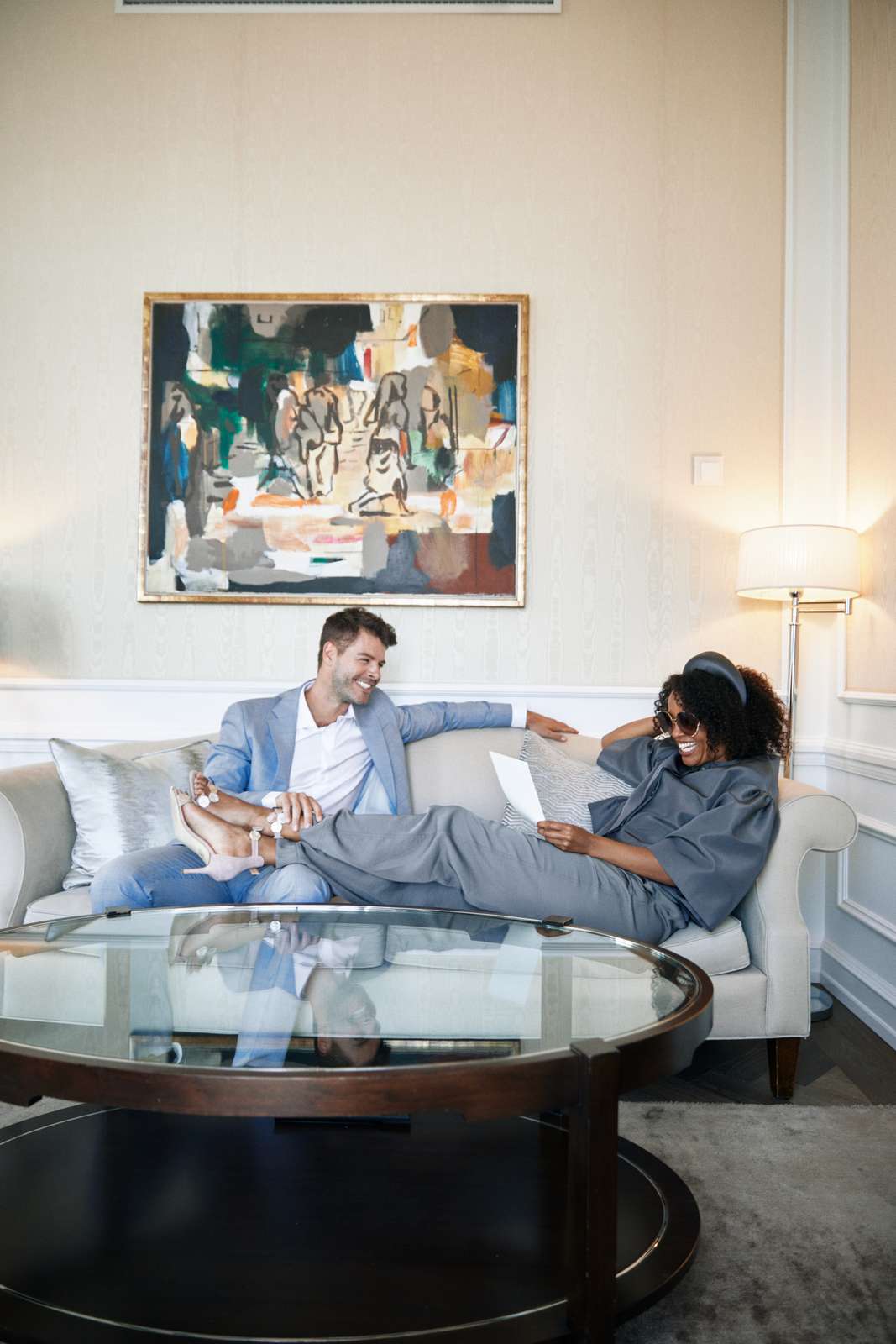 24 couple laughing on sofa in suite .jpg