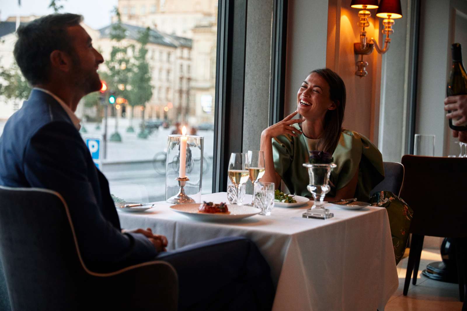 25 couple smiling at table at marchal .jpg
