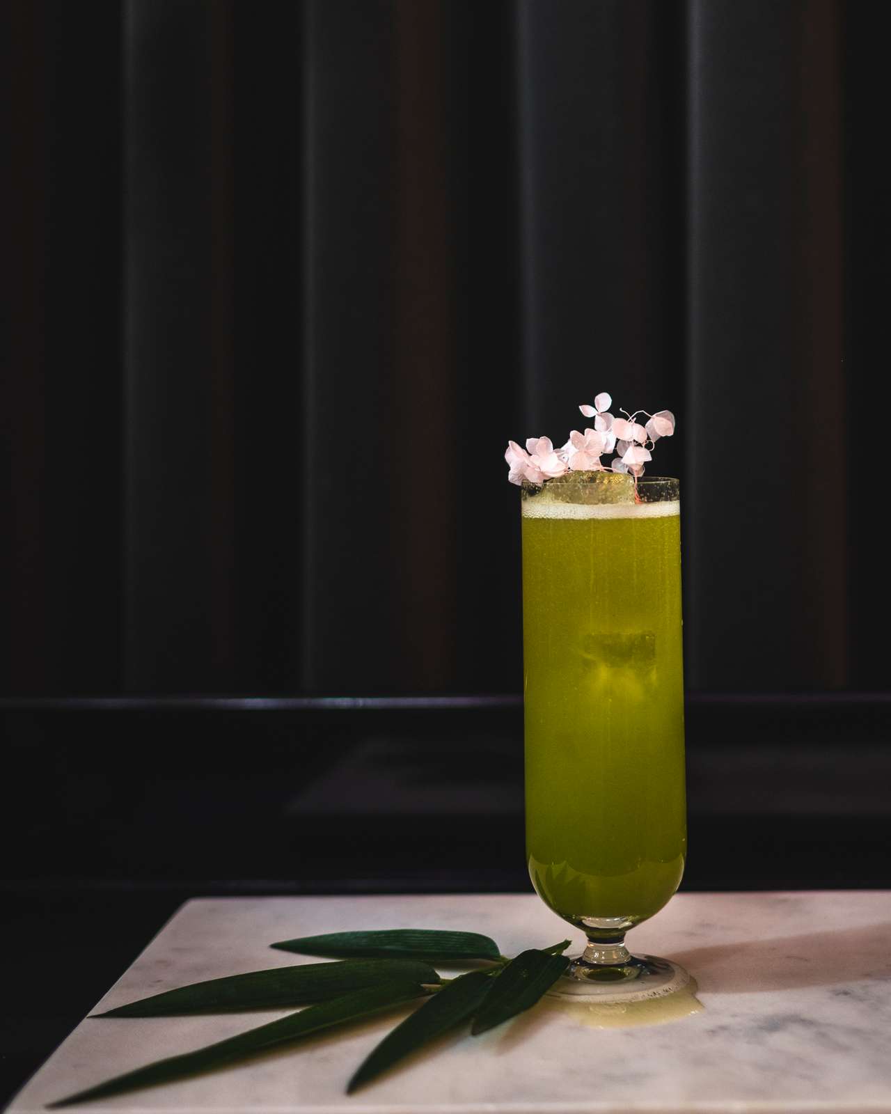Green cocktail with flowers