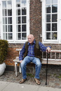 Elderly man sitting on a bench