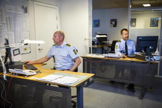 Police officers working at their desks