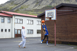 Father and daugther playing basketball on Iceland
