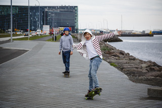 Teenagers on skateboards in Reykjavik Iceland