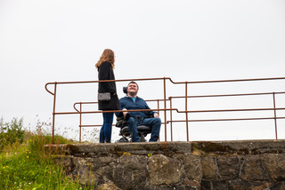 Young woman and man in wheelchair