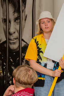 Young woman with poster