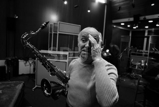 Bud Freeman. Practicing on his saxophone in a recording studio, London, 1975