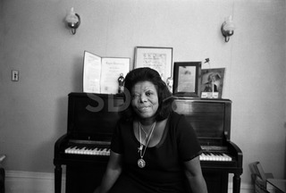 Mary Lou Williams. Being photographed in her home, New York, 1975