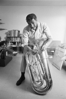 Major Holley. Is cleaning his tuba at his home, New York, 1975