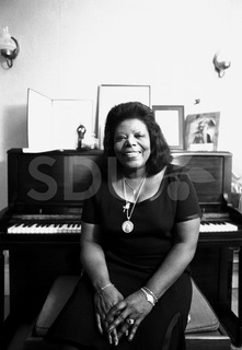 Mary Lou Williams. Being photographed in her home, New York, 1975