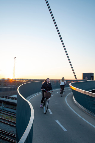 bicyclists on City Bridge Sunrise