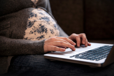 Pregnant woman with labtop
