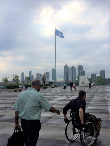 Man in wheelchair outside the UN