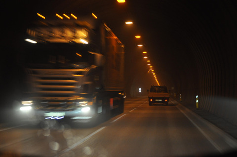 Trucks and cars in tunnel