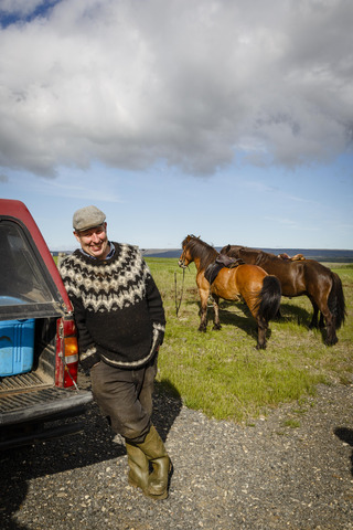 Farmer with horses on Iceland