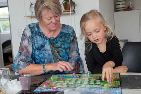 Grandmother and granddaughter playing