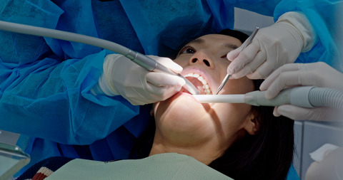 Woman having dental care