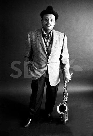 Ben Webster. Practicing on his saxophone in Front Street Studio, New York, 1964