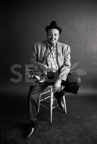 Ben Webster. Practicing on his saxophone in Front Street Studio, New York, 1964