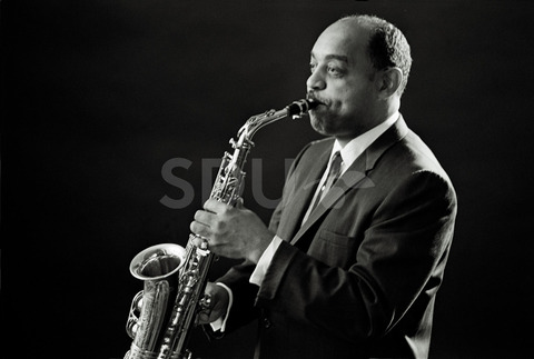 Benny Carter. Practicing on his saxophone in a studio, New York, 1962