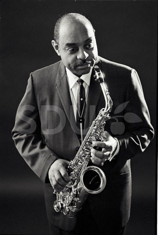 Benny Carter. Practicing on his saxophone in a studio, New York, 1962