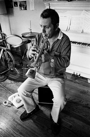 Ruby Braff. Practicing on his trumpet in his home, New York, 1969