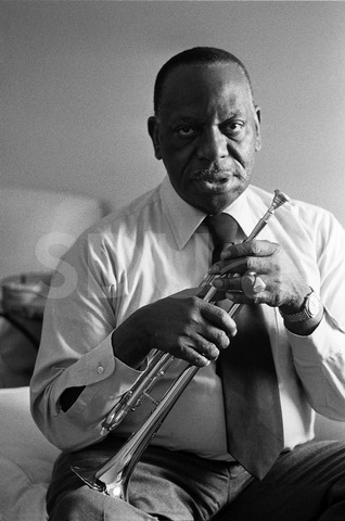 Cootie Williams. Practices the trumpet in his home, New York, 1975