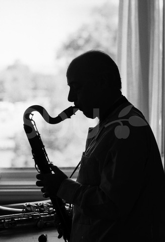 Flip Phillips. Practicing saxophone in his home, Denver, 1975