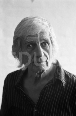 Gil Evans. Being photographed in his home, New York, 1975