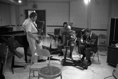 Joe Venuti, Zoot Sims, and Bucky Pizzarelli. Practicing in a rehearsal room, New York, 1975