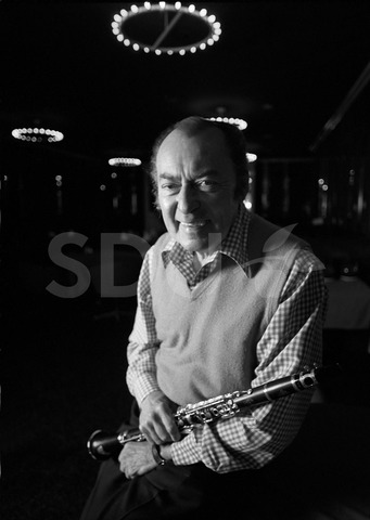 Woody Herman. Practicing on his clarinet before a concert, New York, 1975