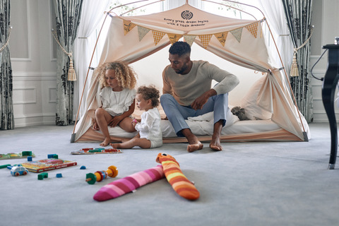 dad and girls playing in tent 2 