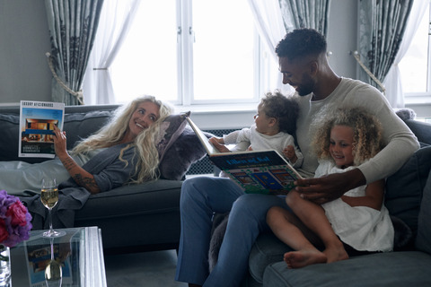 family reading on sofas 4 