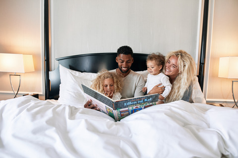 family reading in bed 
