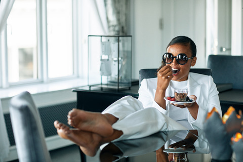 model eating fruit and nuts in suite 