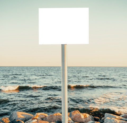 Mockup of a sign on a pole near a seashore. Empty bord on a steel stem.