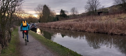 Ryan Smith pedals an e-cycle along Peak Forest Canal during his ride from Manchester to Sheffield. Simon and his colleague Ryan decided to commute via e-cycle to prove that you don't always need to rely on cars and public transport. February 11 2023.