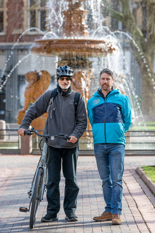 Making cycling e-asier beneficiary Zafar Saleem stands next to Dan Fox after collecting his free one month e-cycle loan from Leicester Bike Park community hub. Taken Monday, 20 Feb 2023. Credit: Leicester City Council
