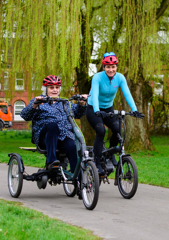 Dame Sarah Storey (right) rides an e-trike alongside participant at the launch of Making cycling e-asier at Wheels for All in Manchester.