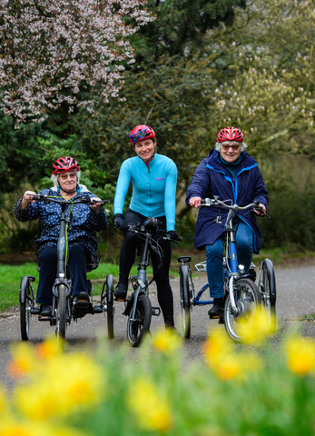 Dame Sarah Storey (middle) rides an e-trike alongside participants at the launch of Making cycling e-asier at Wheels for All in Manchester.