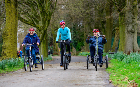Dame Sarah Storey (middle) and participants pedal e-trikes through Debdale Park, Manchester on March 21 2023. Public event took place to mark the launch of Cycling UK's new e-cycle scheme, Making cycling e-asier, at Wheels for All.