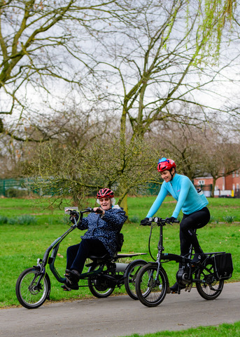 Dame Sarah Storey (right) rides an e-trike alongside a participant at the launch of Making cycling e-asier at Wheels for All in Manchester.