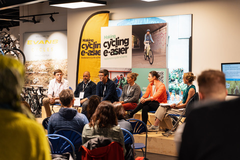Left to right - James Scott, Mohammed Ali, Andy Burnham, Tracy Moseley, Dame Sarah Storey and Sarah Mitchell (host) all take part in panel discussion which covers the importance of schemes such as Making cycling e-asier which remove barriers and allow people to try e-cycling.
