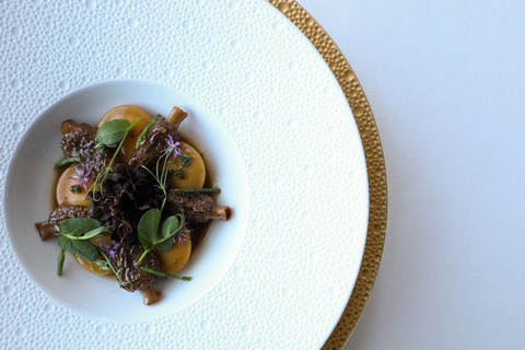 Bottoni pasta with gruyére, truffle, morels and mushroom consommé